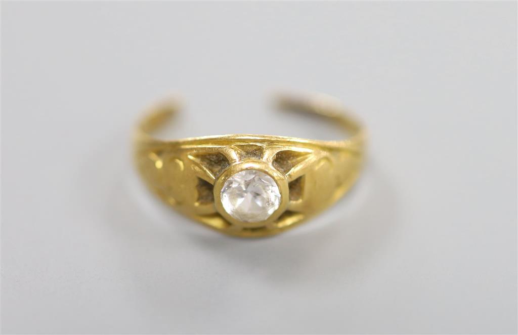 A yellow metal(tests as 18ct) and white stone set ring, cut, gross 2.2 grams.